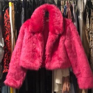 A faux fur pink cropped jacket